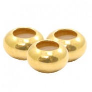 DQ metall Perle Disc 6x3mm mit Gummi innen Gold